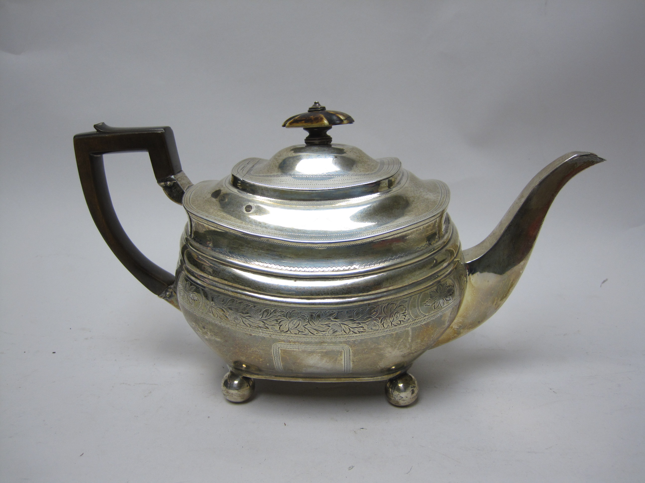 A George III silver boat shape Teapot with leafage engraved frieze on ball feet, London 1811 - Image 2 of 3