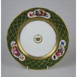 A rare Davenport porcelain Plate, centre with gilt crown and serpent, dentil cavetto green and