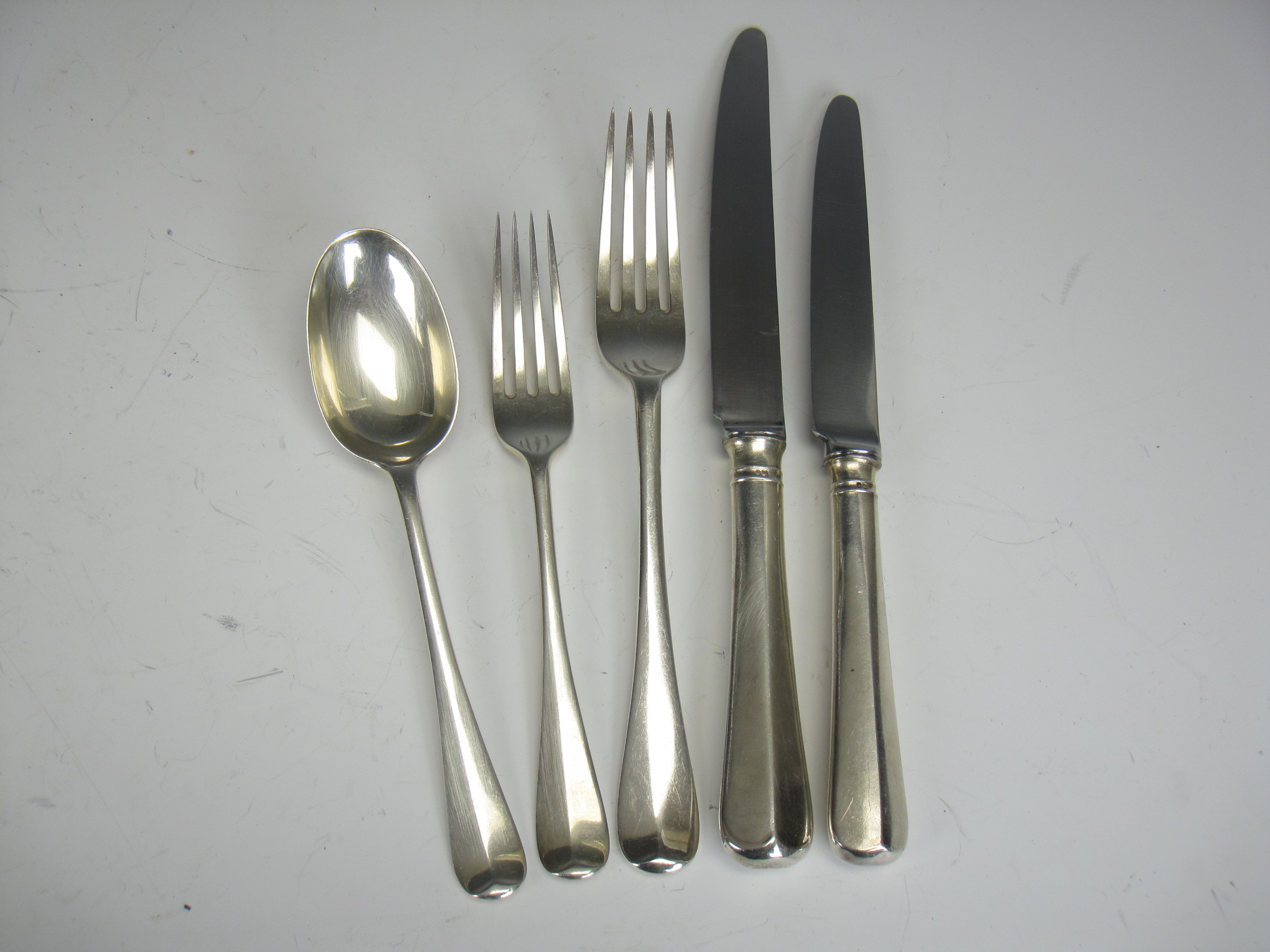 Twelve Edward VII silver Dinner and Dessert Forks and eleven Dessert Spoons Hanoverian pattern