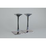 A pair of modern silver Designer Candlesticks with slender stems on square bases, Sheffield 2000,