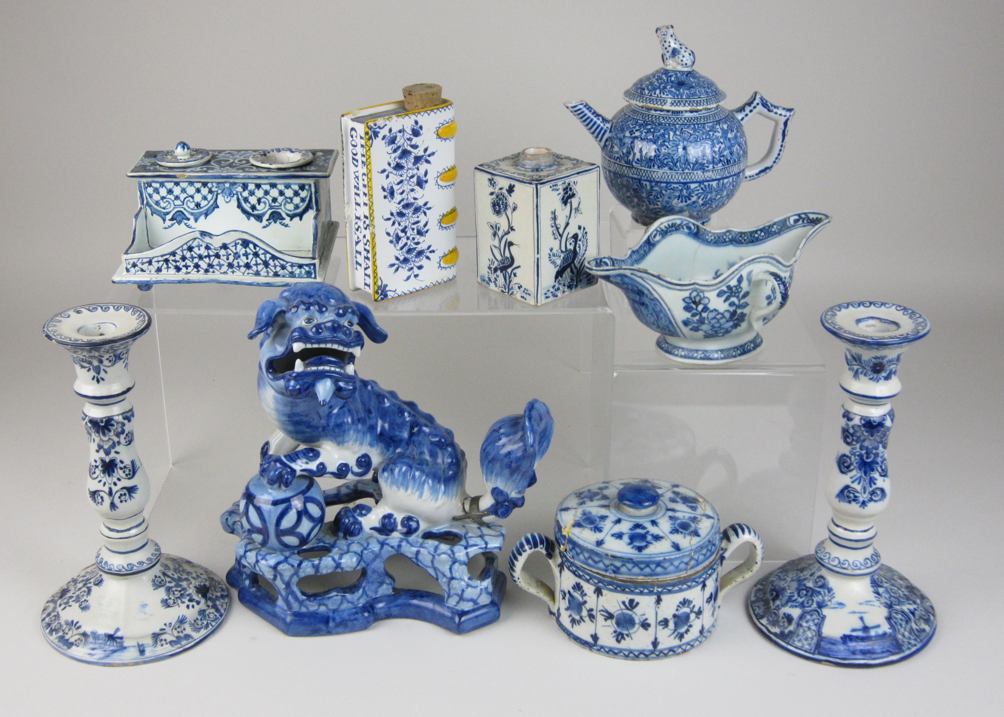 A mixed group of blue and white Delft Items, including an 18th Century Dutch drum posset pot and