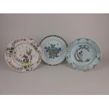 Three Delft Plates, one having standing chinoiserie figure under a tree branch with chequered