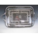 A Victorian plated two handled Tea Tray with scroll engraved friezes and monogram, gadroon rim,