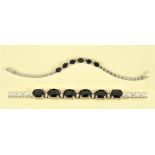 A Sapphire and Diamond Bracelet, the front claw-set six oval-cut sapphires, total sapphire weight