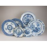 Six blue and white Delft Dishes, including four chargers, two 18th Century and decorated with