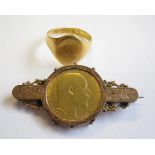 An Edward VII Sovereign 1906 in 9ct brooch mount and a 22ct gold Signet Ring