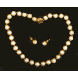 An 18ct gold and Cultured Pearl Necklace in the style of Charles de Temple having thirty four