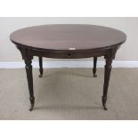 A Georgian style D-end wind-out extending Dining Table with two spare leaves mounted upon four