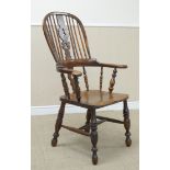 A 19th Century yew and beech broad arm Windsor Elbow Chair with pierced splat and stick back,