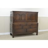 An 18th Century oak Carmarthen Chest with pair of 'cupid's bow' panelled doors above five drawers