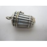 A Victorian silver cylindrical Vinaigrette of thimble shape with fluted and spider's web design,