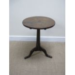 An 18th Century oak Pillar Table with circular top on turned tapering column and tripod base, 18in