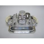 A Victorian silver square Inkstand fitted glass inkwell, boar tusk handles, London 1900, maker: