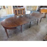 A late Georgian mahogany Dining Table with reeded top, pair of half round ends and extra leaves on