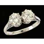 A Diamond two stone Ring claw-set brilliant-cut stones, estimated total weight 1.70cts, in 18ct