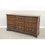 An 18th Century oak Lancashire Chest fitted nine drawers with mahogany cross-banding on bracket