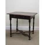 An 18th Century oak Side Table with moulded top, fitted frieze drawer on balsuter turned supports