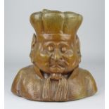 An unusual stoneware Tobacco Jar, c1900, modelled as a bust of an imp wearing lobed bat and