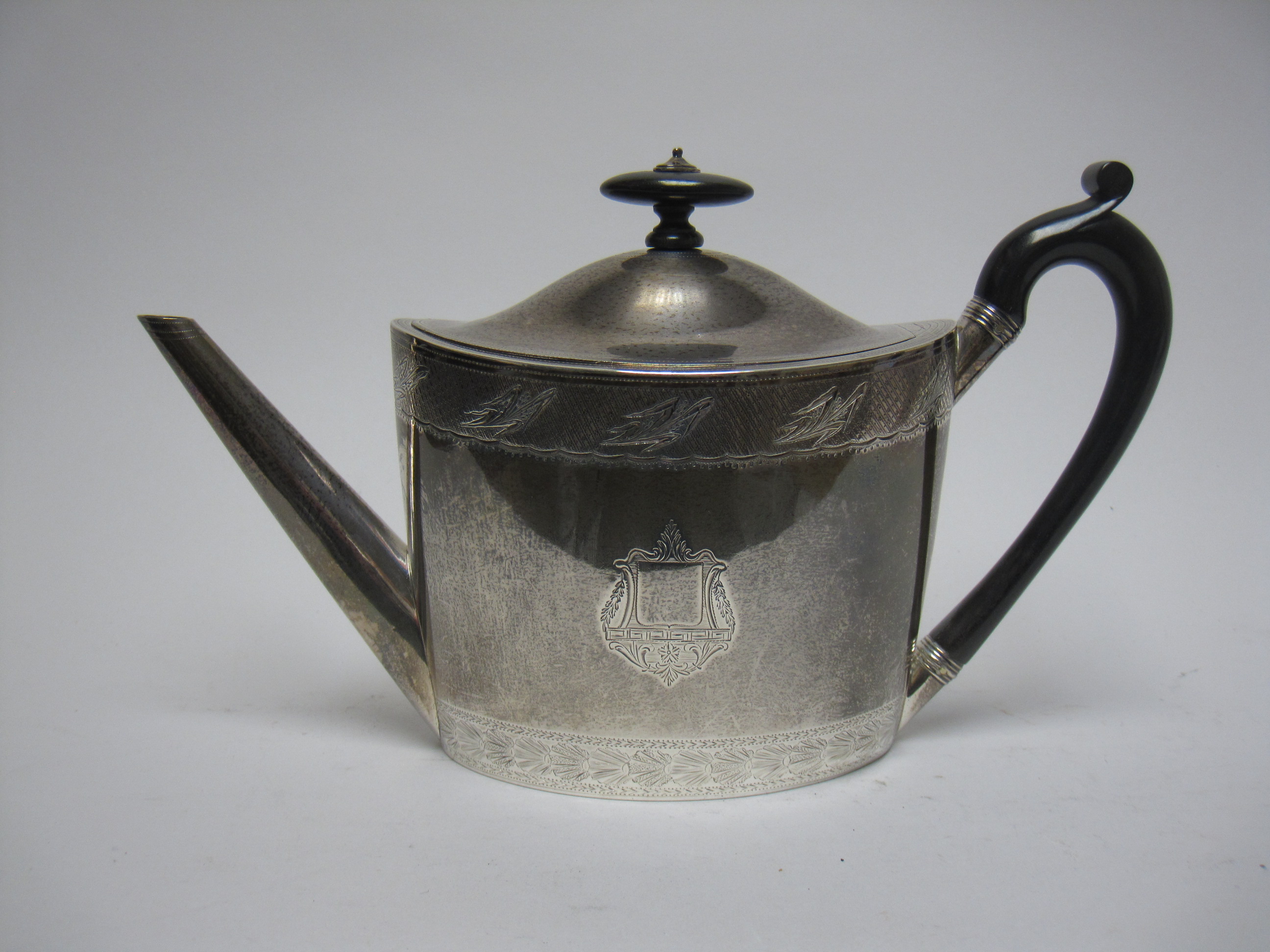 A George III silver oval Teapot with engraved frieze and crests, ebonised handle, London 1797, - Image 5 of 21