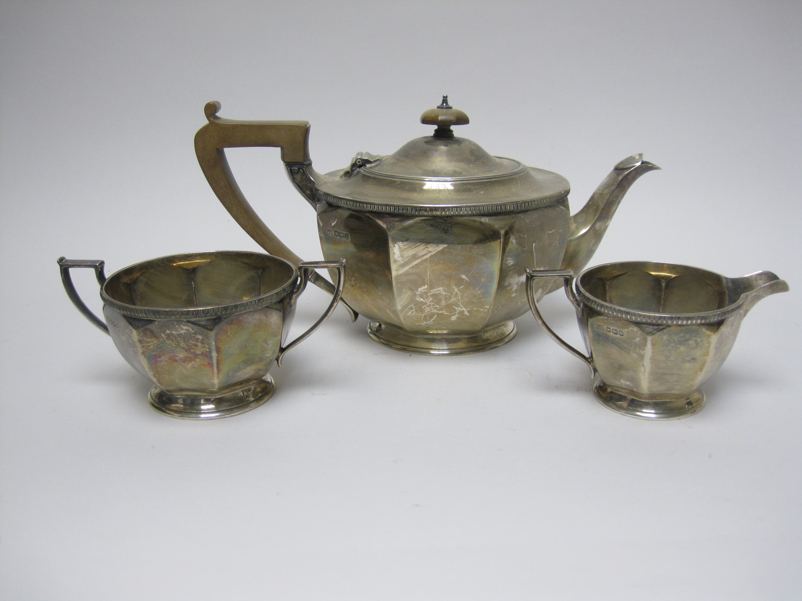 A George V silver circular three piece Tea Service, Sheffield 1930