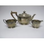 A George V silver circular three piece Tea Service, Sheffield 1930