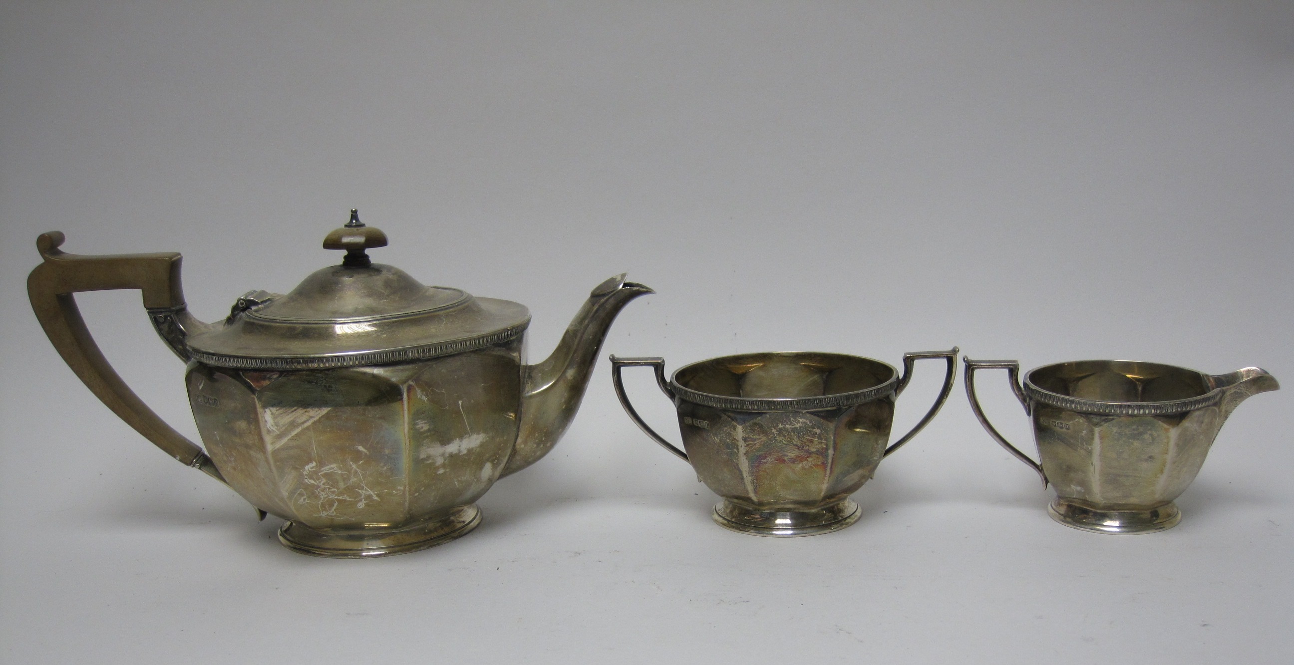 A George V silver circular three piece Tea Service, Sheffield 1930 - Image 4 of 4