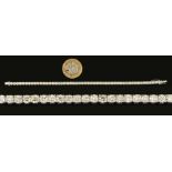 A Diamond Tennis Bracelet having fifty two articulated links each claw-set brilliant-cut stone,