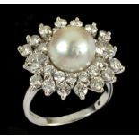 A Cultured Pearl and Diamond Cluster Ring set cultured pearl within double frame of brilliant-cut