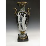 A Continental porcelain two handled Vase of urn shape having moulded top with art deco designs in