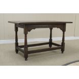 A late 17th Century oak Tavern Table with cleated plank top on baluster turned and square legs