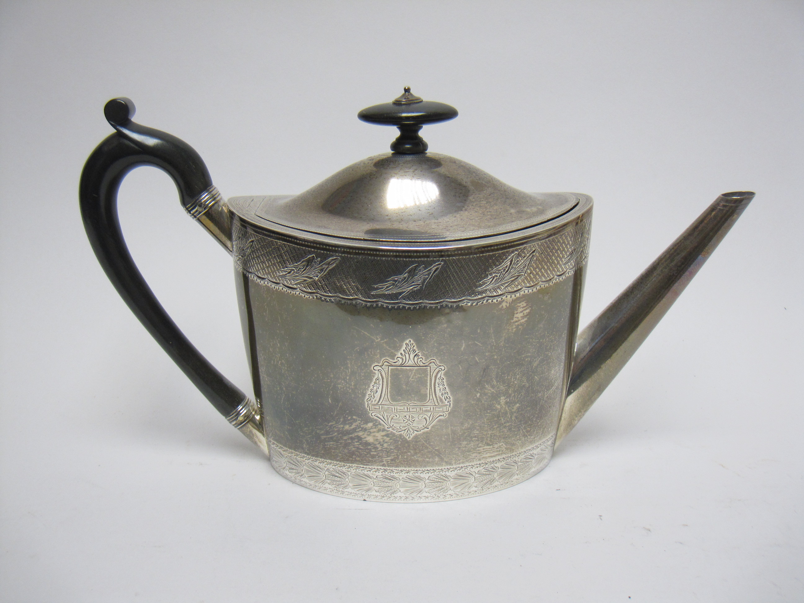 A George III silver oval Teapot with engraved frieze and crests, ebonised handle, London 1797, - Image 2 of 21