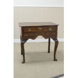 An 18th Century oak Lowboy with cross-banded top above one long and two short cross-banded drawers