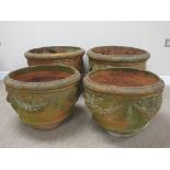 Four terracotta Flower Pots with swag and mask designs, A/F