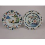 Two English Delft Plates with similar polychrome coloured decoration, one with chinoiserie figure in
