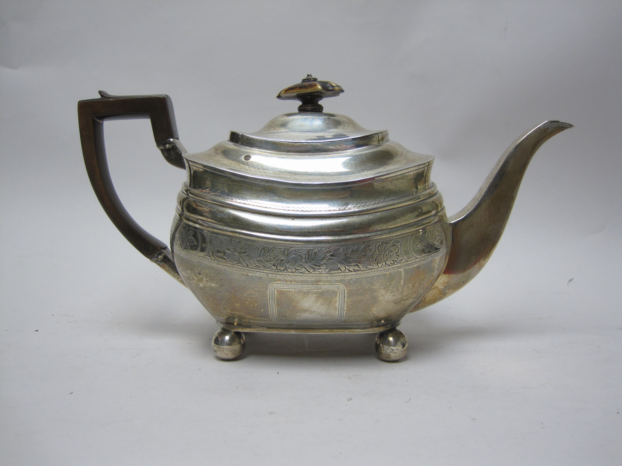 A George III silver boat shape Teapot with leafage engraved frieze on ball feet, London 1811 - Image 3 of 3