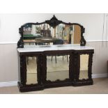 A Victorian mahogany mirror back Sideboard with marble top above four mirrored cupboard doors, all