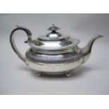 A George III silver boat shape Teapot engraved initials, leafage scroll handle on ball feet,