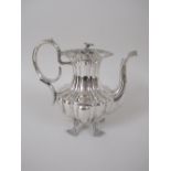 A 19th Century Swedish silver Coffee Pot of fluted form on ornate scallop and scroll supports with
