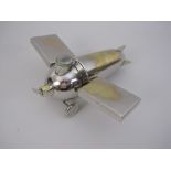 An unusual electroplated Novelty Aeroplane Smoker's Set, with match compartment and striker,