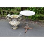 A Victorian cast iron Garden Table with white marble top on fluted column and tripod base, 23in, and