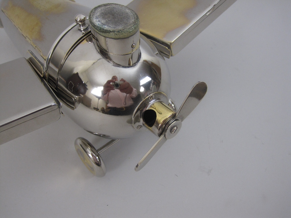 An unusual electroplated Novelty Aeroplane Smoker's Set, with match compartment and striker, - Image 9 of 11