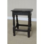 A 17th Century oak Joint Stool with moulded rectangular top above carved frieze and initials D.I. on