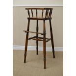 A 19th Century ash and elm Child's High Chair with spindle frieze, solid seat on turned supports