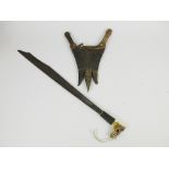 Two Sudanese Daggers in crocodile skin Scabbard, an Indonesian Man Dau and an Indian double