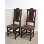 A pair of late 17th Century oak Side Chairs with scroll carved top rails, fielded panel backs, solid