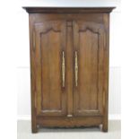 A French fruitwood Armoire with star inlay above a pair of shaped panelled doors, 6ft 8in H x 4ft