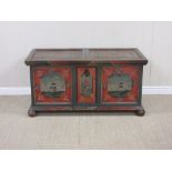 A 19th Century Continental painted pine Blanket Box with two panel lid painted red flowers, the