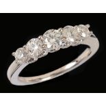 A Diamond five stone Ring claw-set graduated brilliant-cut stones (one chipped) in 18ct white