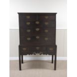 An 18th Century oak Chest on Stand, the upper section fitted two short and three long drawers, the