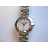 A lady's Yves Saint Laurent Wristwatch, the white dial with arabic numerals at 3, 6, 9, and 12,